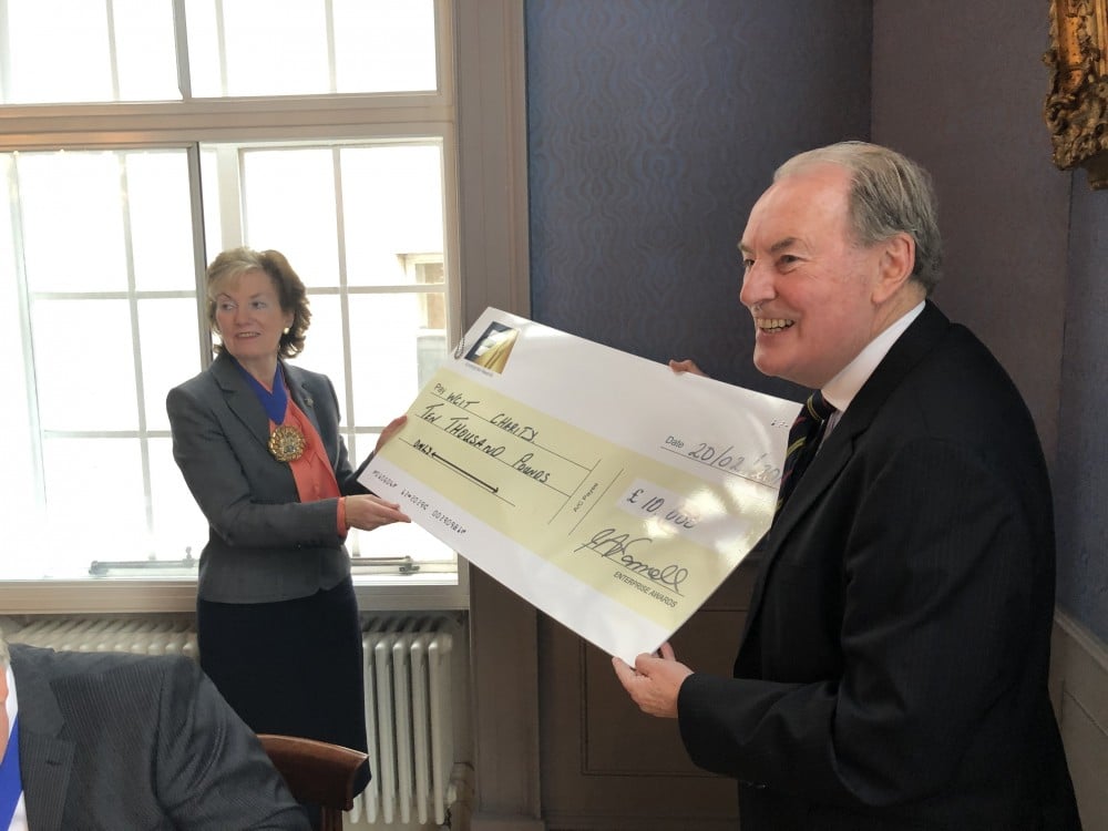 ScaleUp Group Chair John O’Connell presents a £10K cheque to WCIT Master Lady Parmley